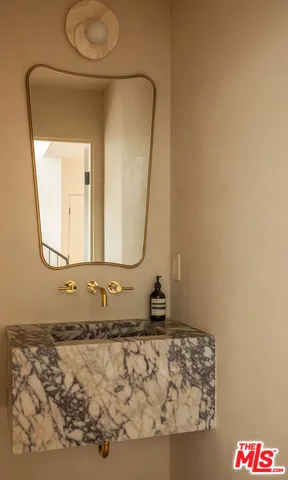 a bedroom with a bed and a night stand