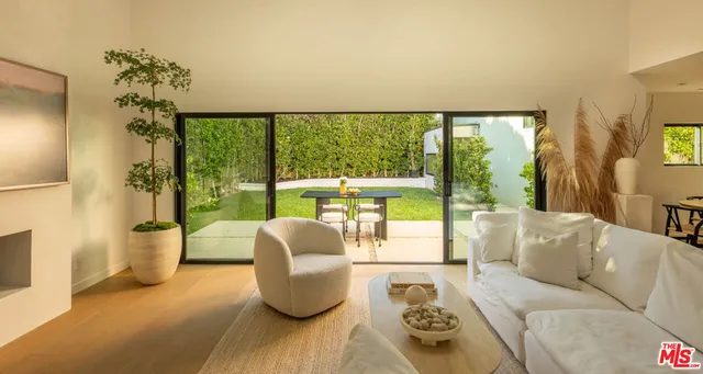 a en suite bathroom with a double vanity sink and mirror with shower