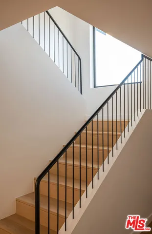 a view of a room with furniture and a window