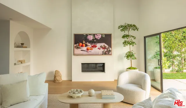 a view of staircase with railing and white walls