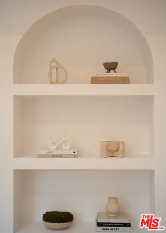 a large bed in a bedroom next to a bathroom