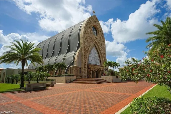 a view of a palm trees in front of a building