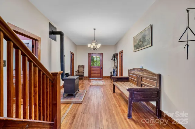 a view of a livingroom with furniture and stairs