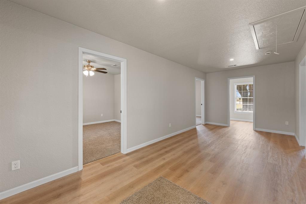 401 Edgewood Lane Cleburne, TX 76031 - Photo 18 of 39 wooden floor in an empty room