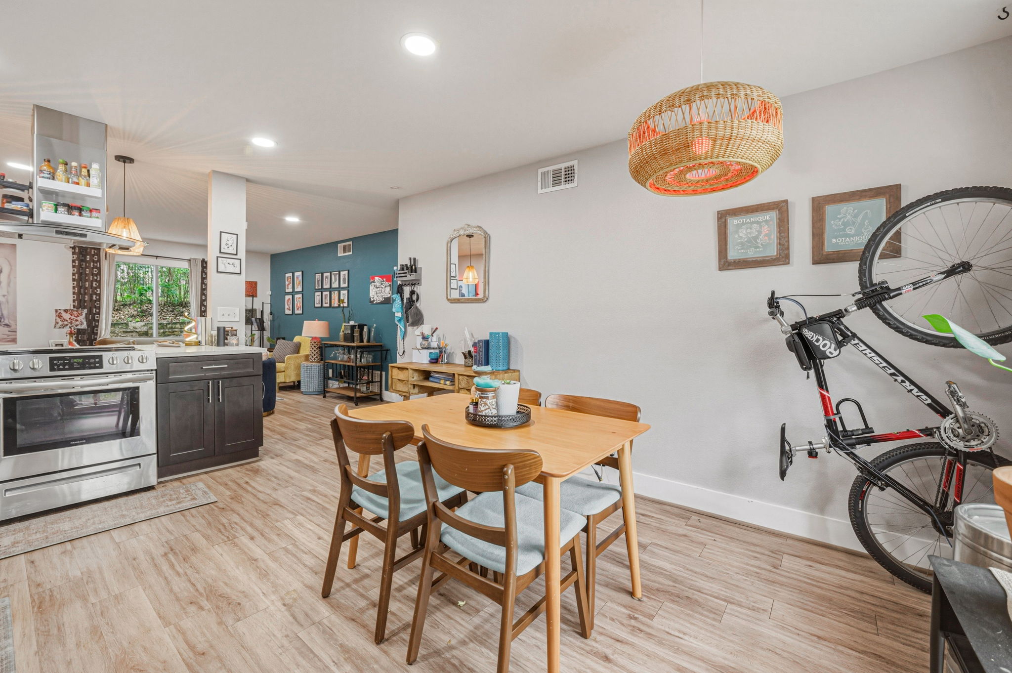5332 Balcones Drive, Unit B Austin, TX 78731 - Photo 4 of 15 This property features light-toned flooring, a kitchen with stainless steel appliances, and dark kitchen cabinetry