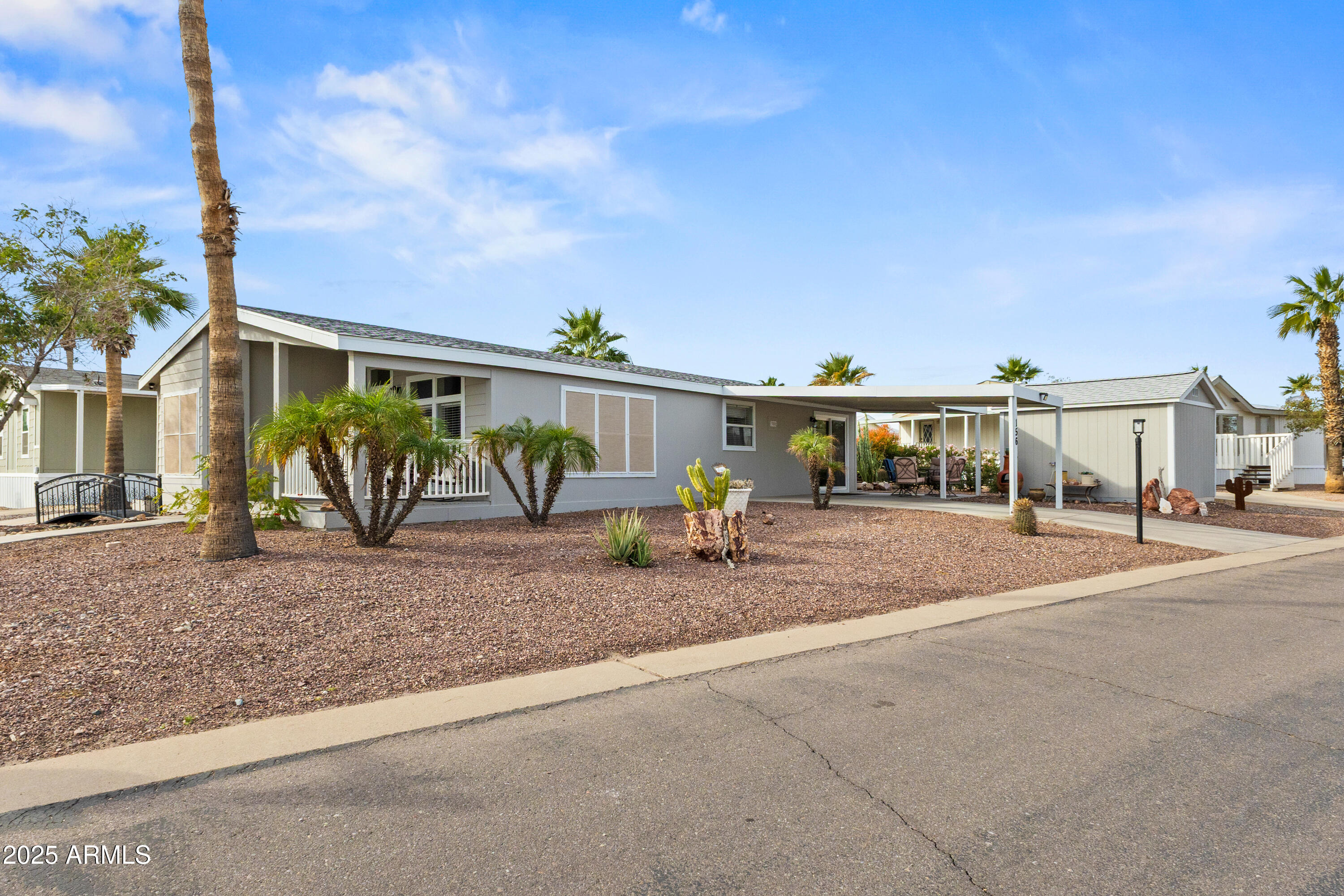 2000 South Apache Road, Unit 156 Buckeye, AZ 85326 - Photo 2 of 40 a view of a house with backyard and sitting area