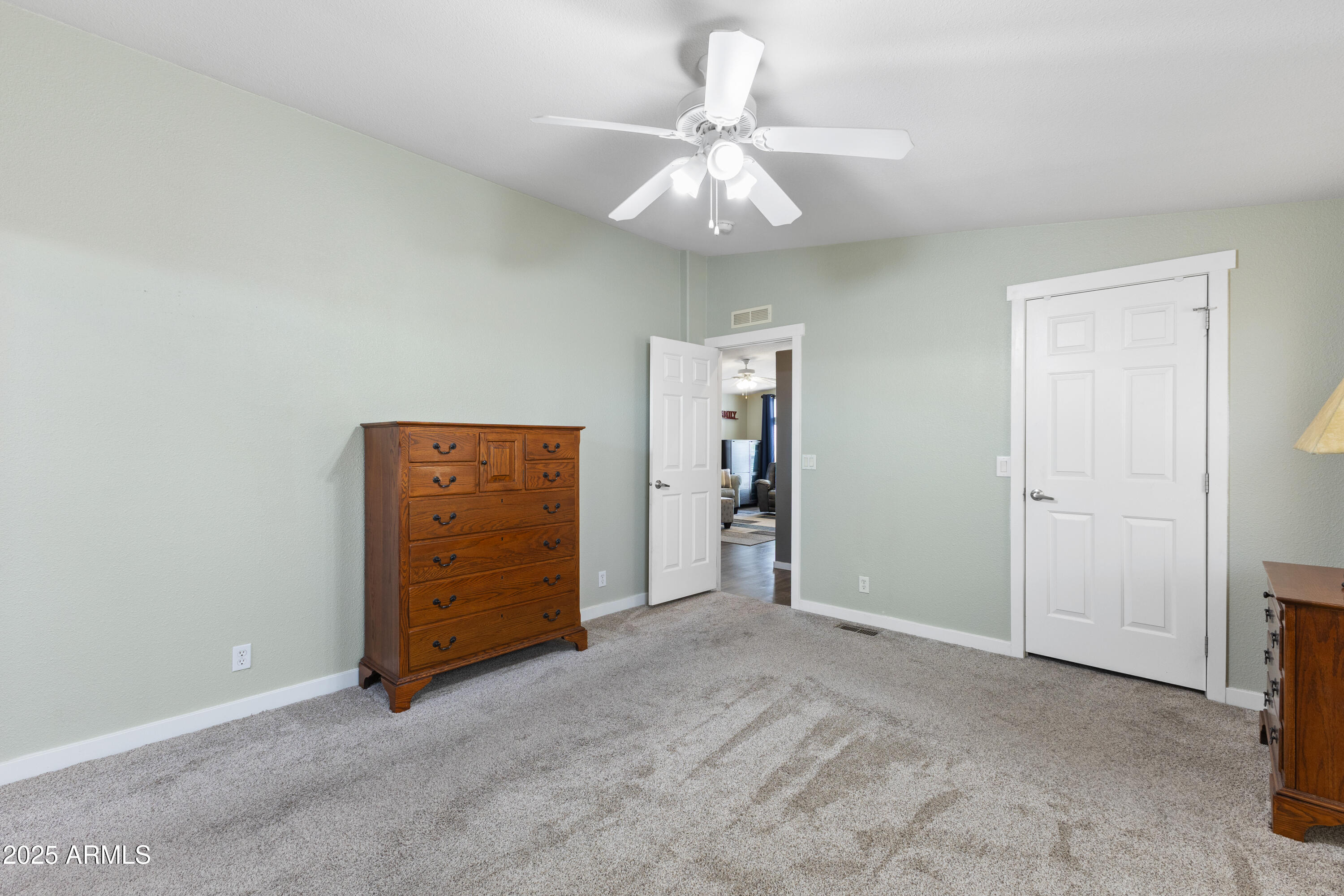 2000 South Apache Road, Unit 156 Buckeye, AZ 85326 - Photo 24 of 40 an empty room with closet and a ceiling fan