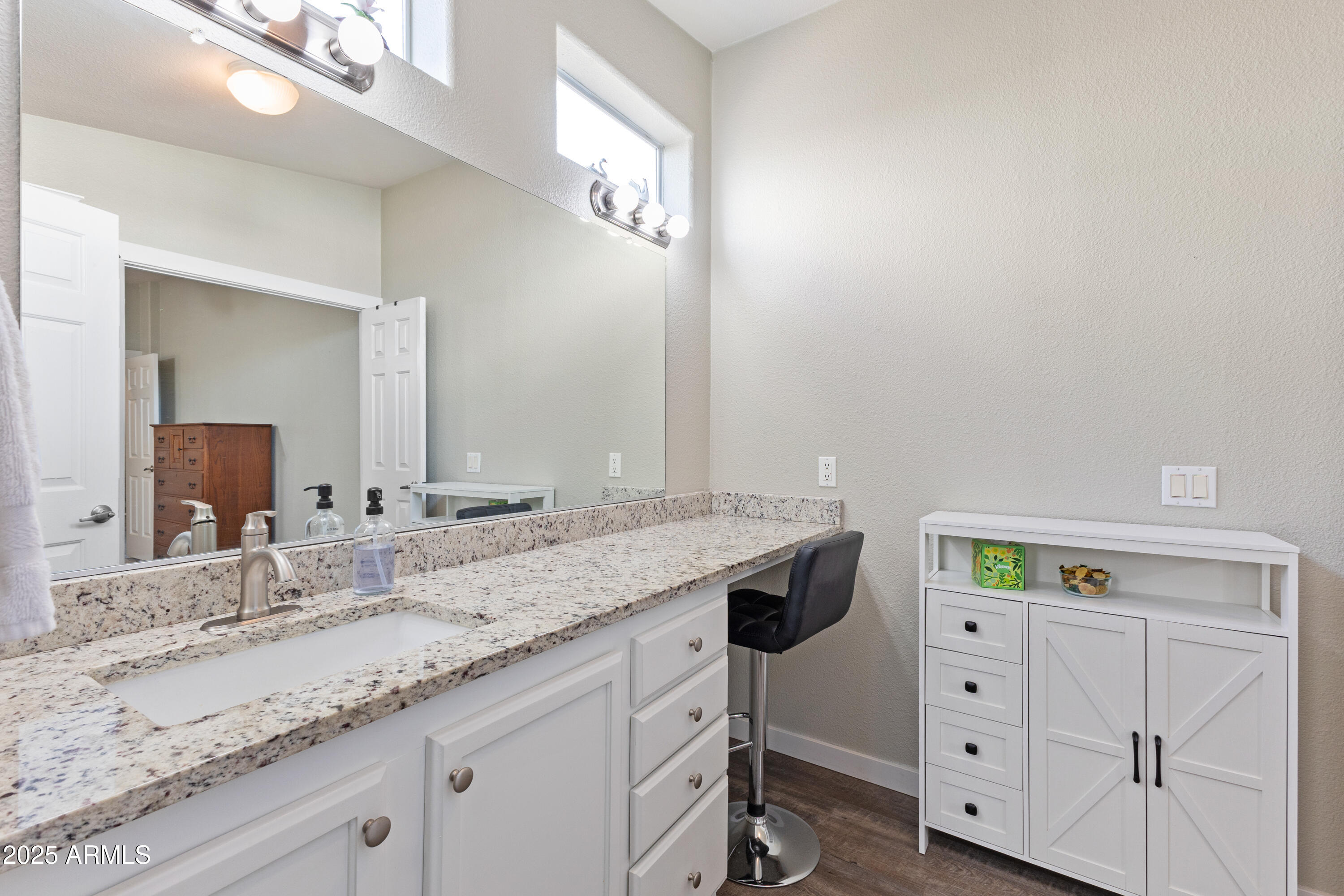 2000 South Apache Road, Unit 156 Buckeye, AZ 85326 - Photo 28 of 40 a bathroom with a granite countertop sink and a mirror