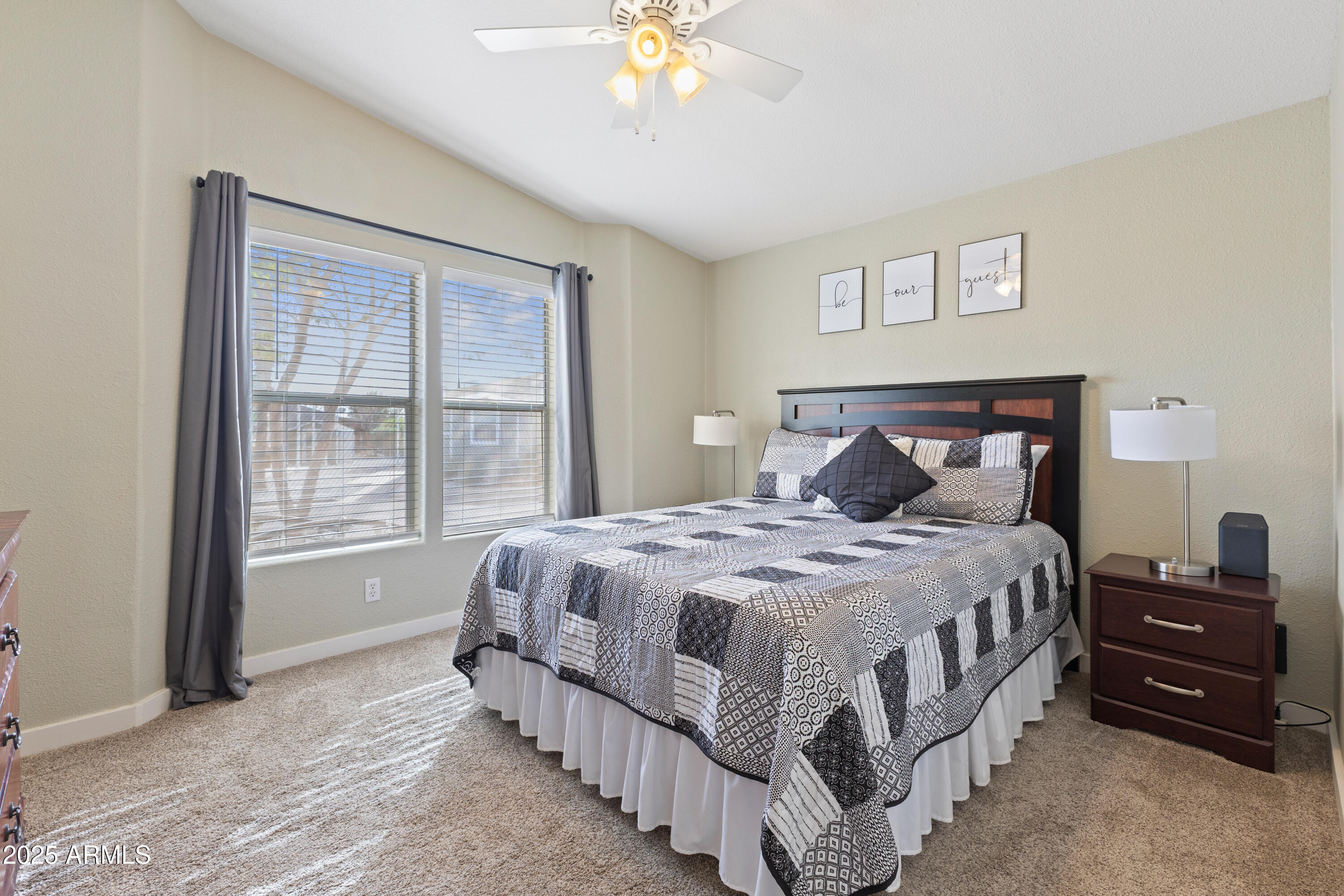 2000 South Apache Road, Unit 156 Buckeye, AZ 85326 - Photo 29 of 40 a bedroom with a bed and a chandelier