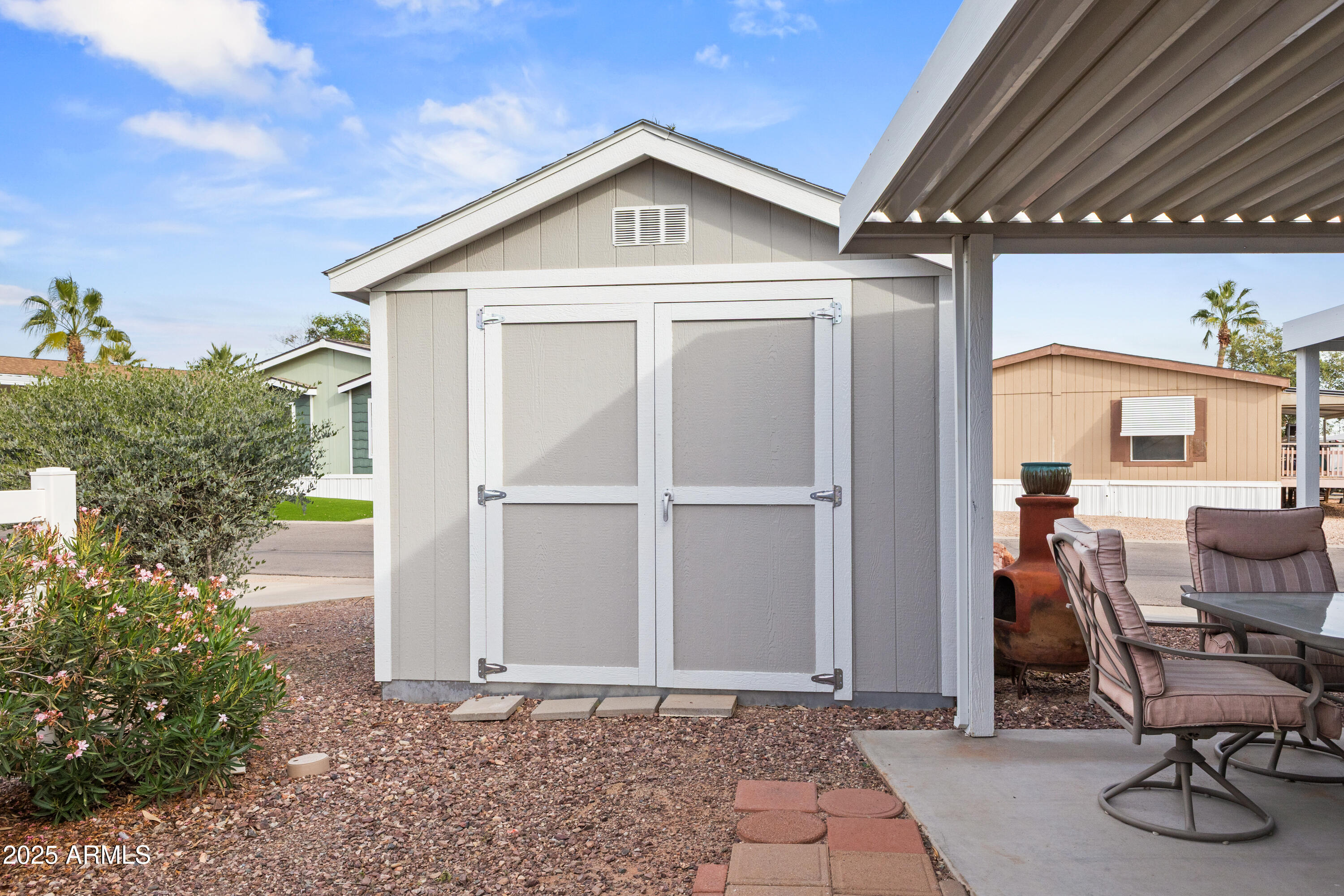 2000 South Apache Road, Unit 156 Buckeye, AZ 85326 - Photo 34 of 40 a front view of a house with garden
