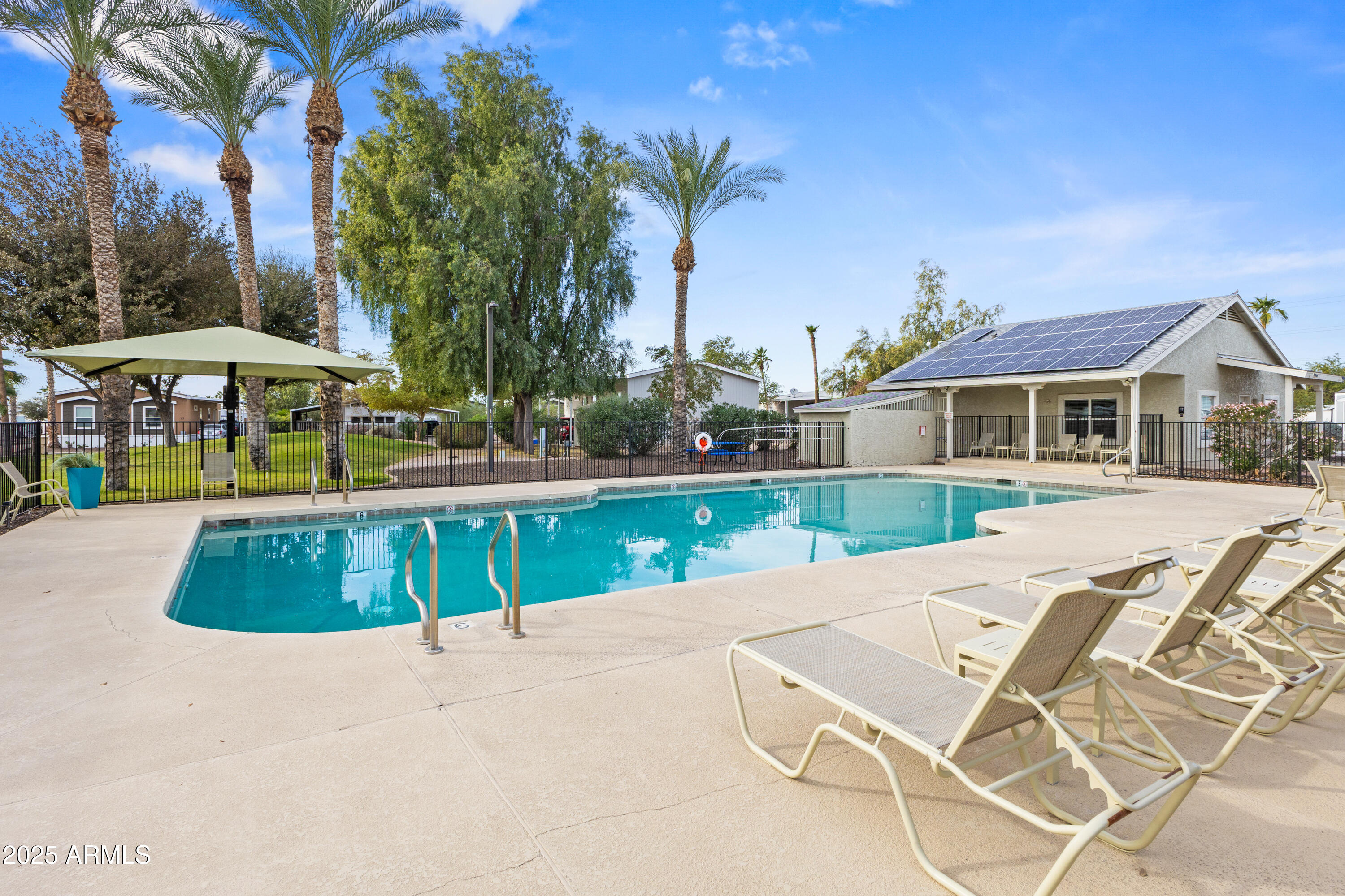 2000 South Apache Road, Unit 156 Buckeye, AZ 85326 - Photo 39 of 40 a view of a house with swimming pool and sitting area