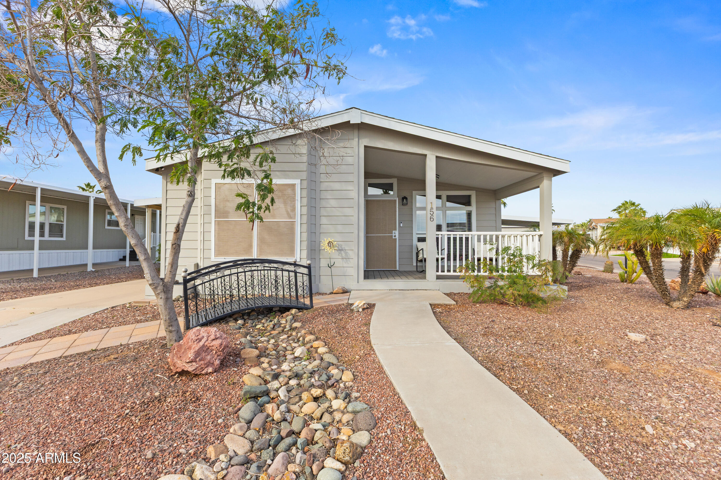2000 South Apache Road, Unit 156 Buckeye, AZ 85326 - Photo 4 of 40 a front view of a house with garden