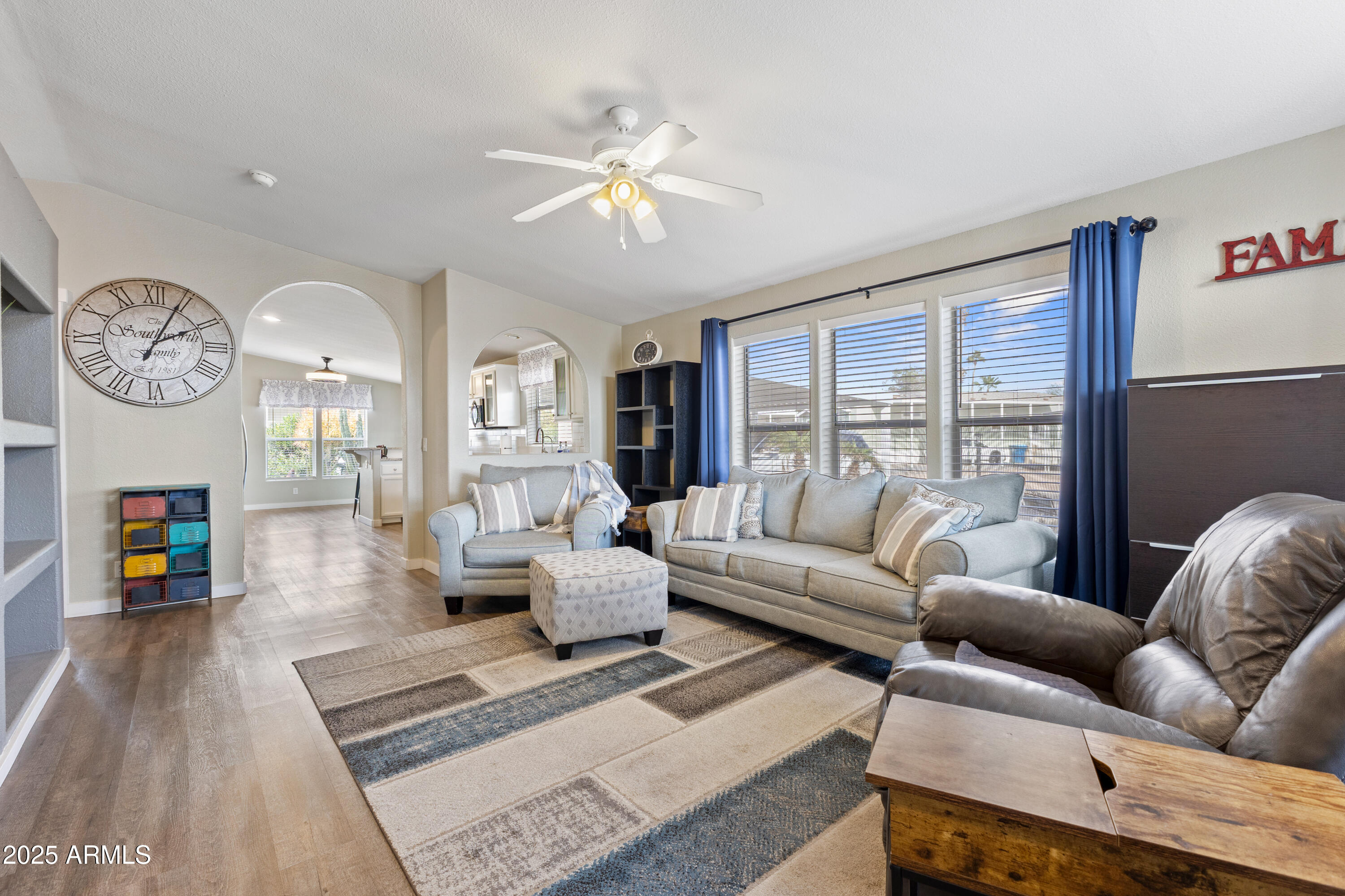 2000 South Apache Road, Unit 156 Buckeye, AZ 85326 - Photo 7 of 40 a living room with furniture and a fireplace