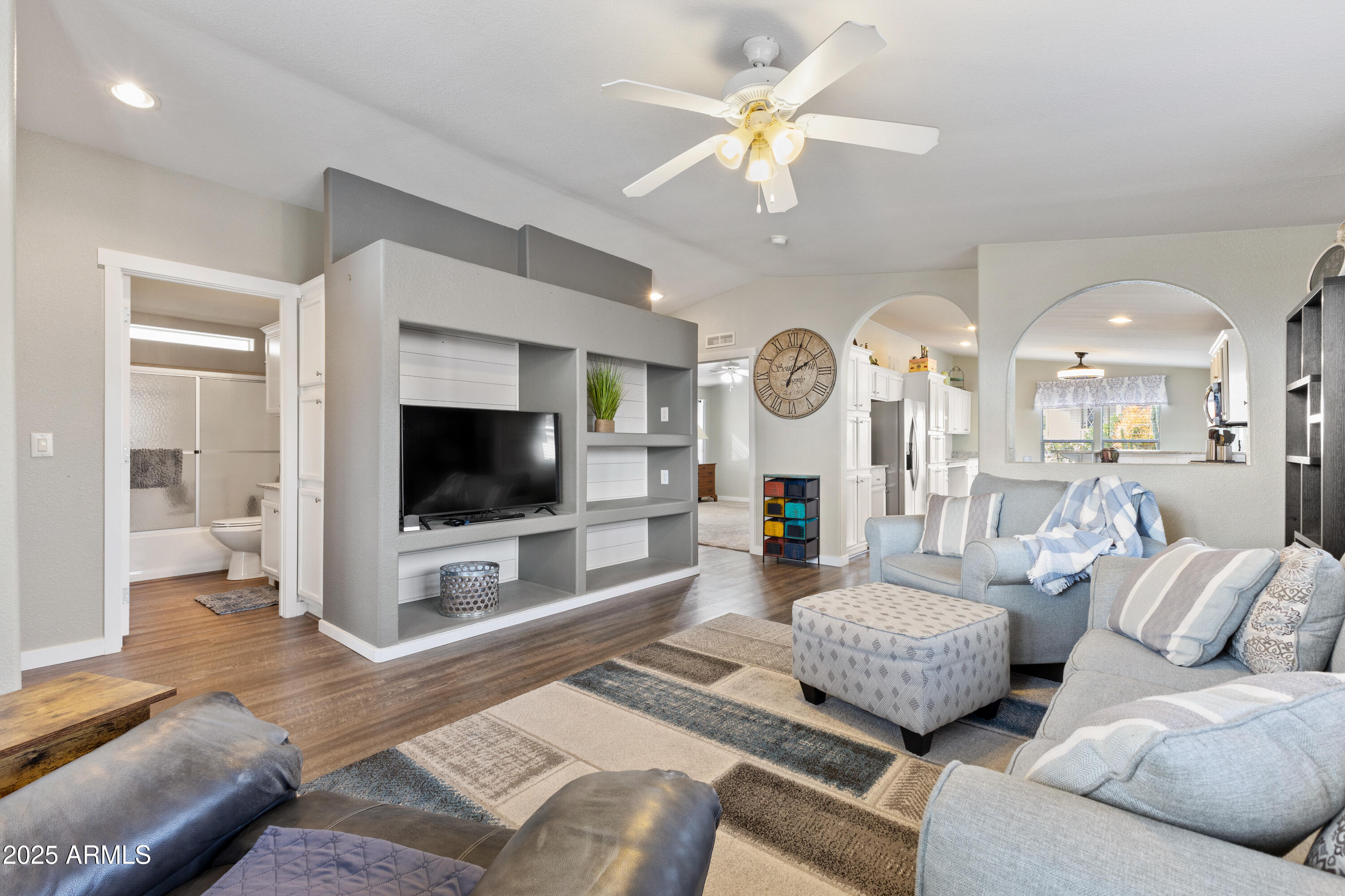 2000 South Apache Road, Unit 156 Buckeye, AZ 85326 - Photo 8 of 40 a living room with furniture and a flat screen tv