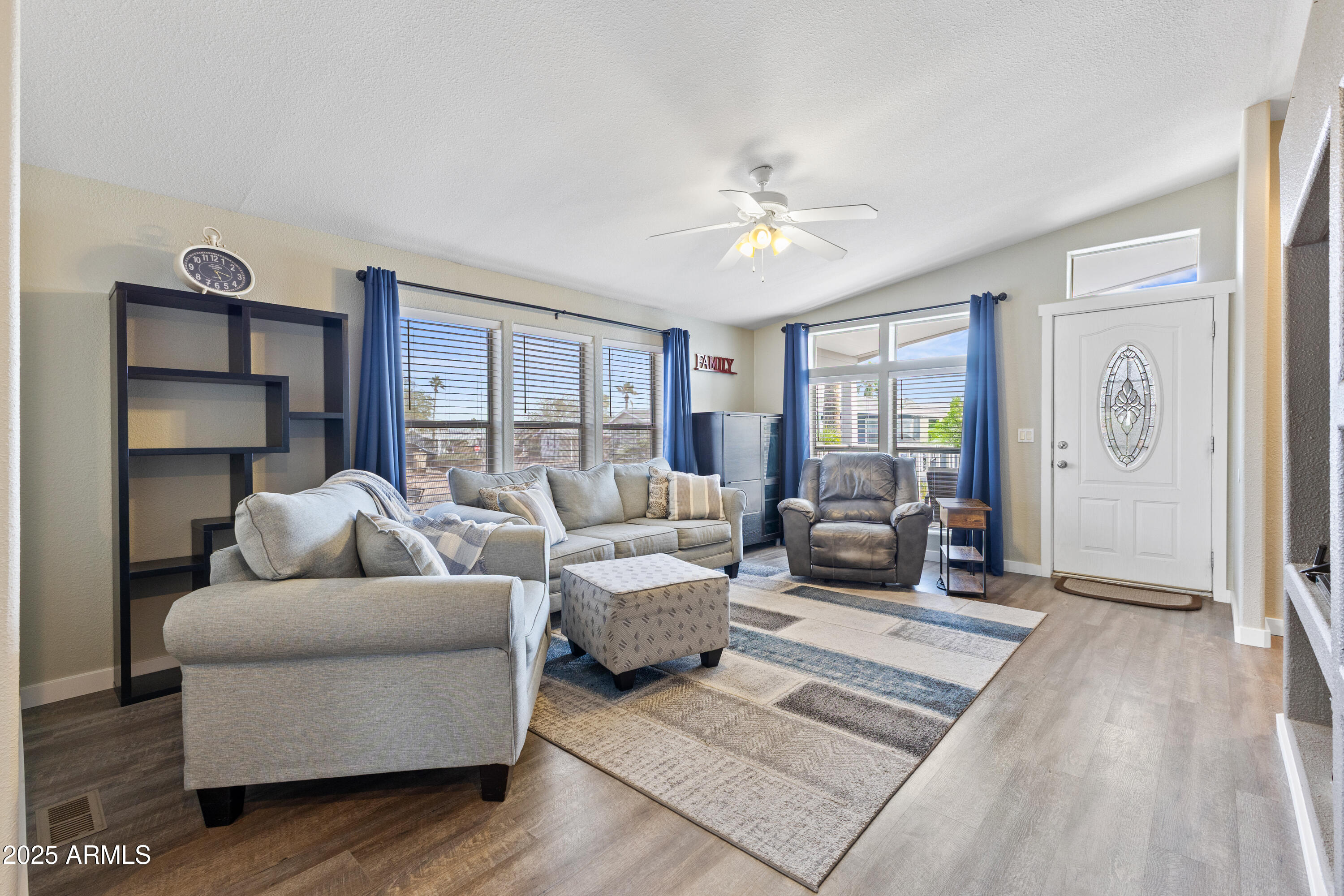 2000 South Apache Road, Unit 156 Buckeye, AZ 85326 - Photo 9 of 40 a living room with furniture and a wooden floor