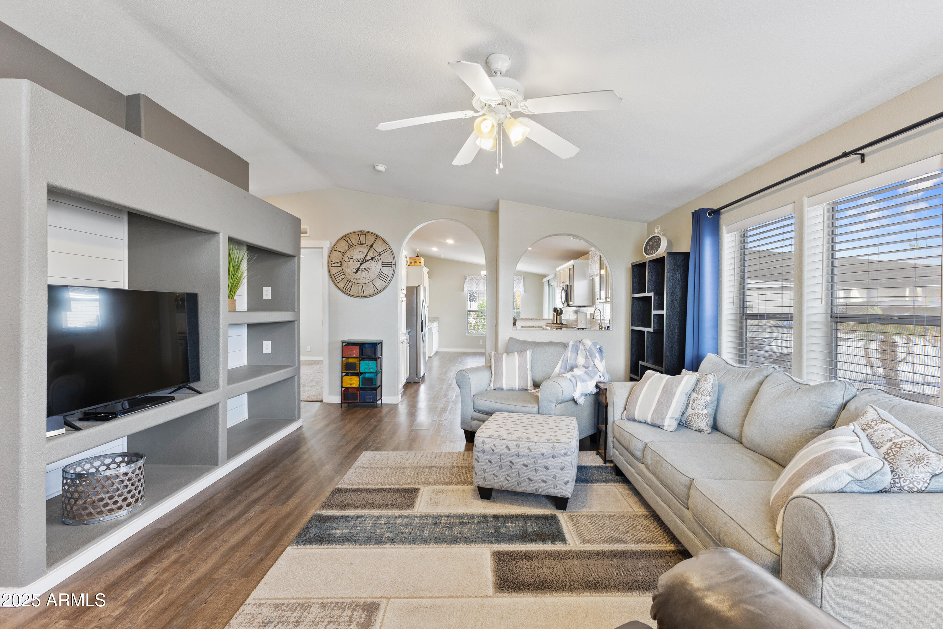 2000 South Apache Road, Unit 156 Buckeye, AZ 85326 - Photo 10 of 40 a living room with furniture and a flat screen tv