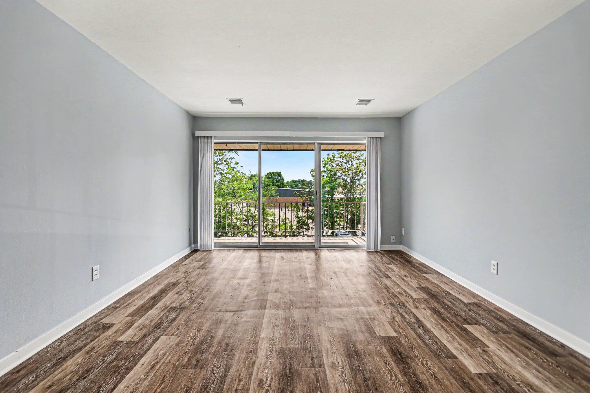 734 West Kilgore Road, Unit 303 Kalamazoo, MI 49008 - Photo 12 of 33 Living Room with Balcony
