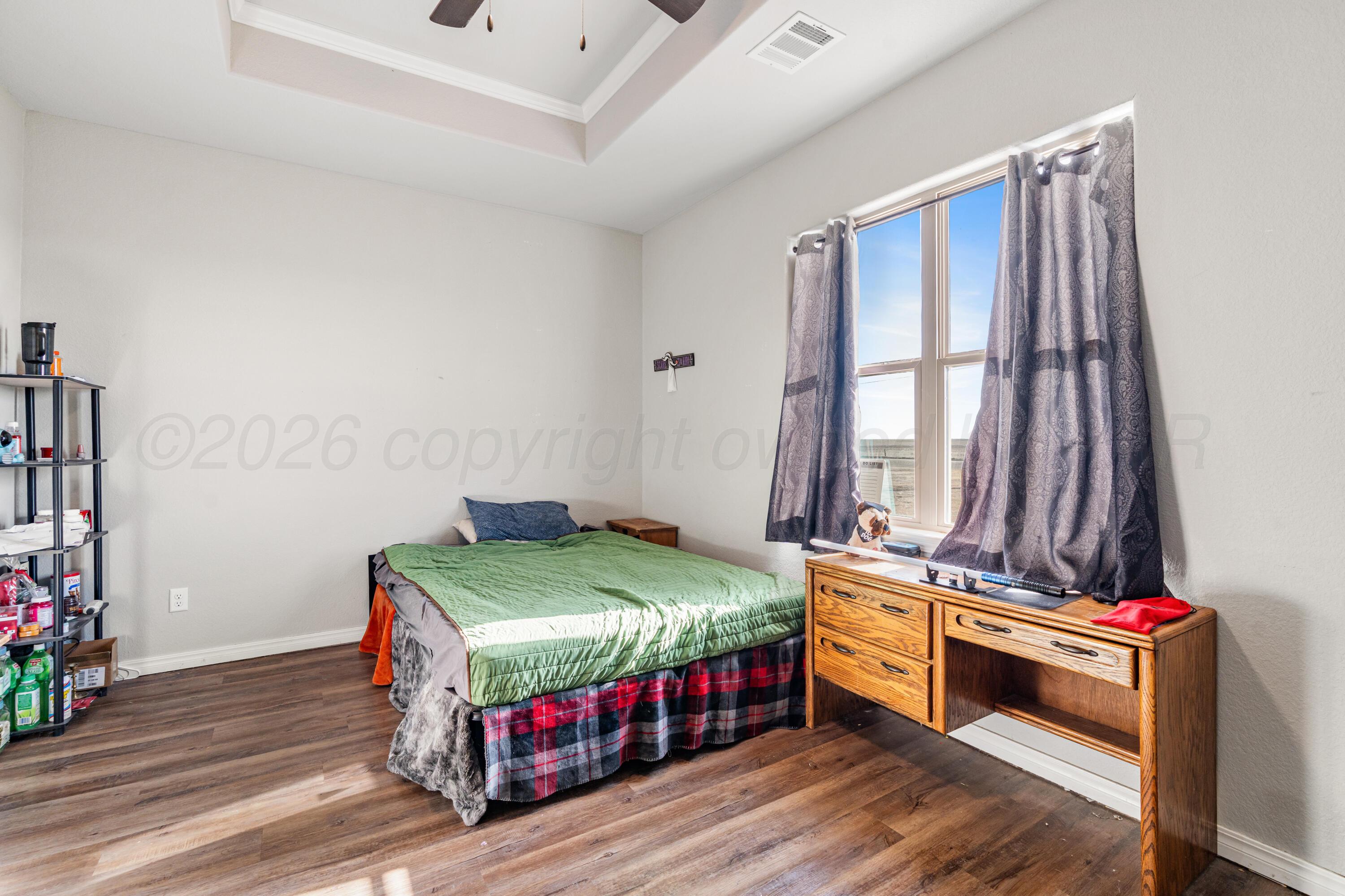 151 North Fm 2381 Amarillo, TX 79124 - Photo 20 of 36 a bedroom with a bed and a window