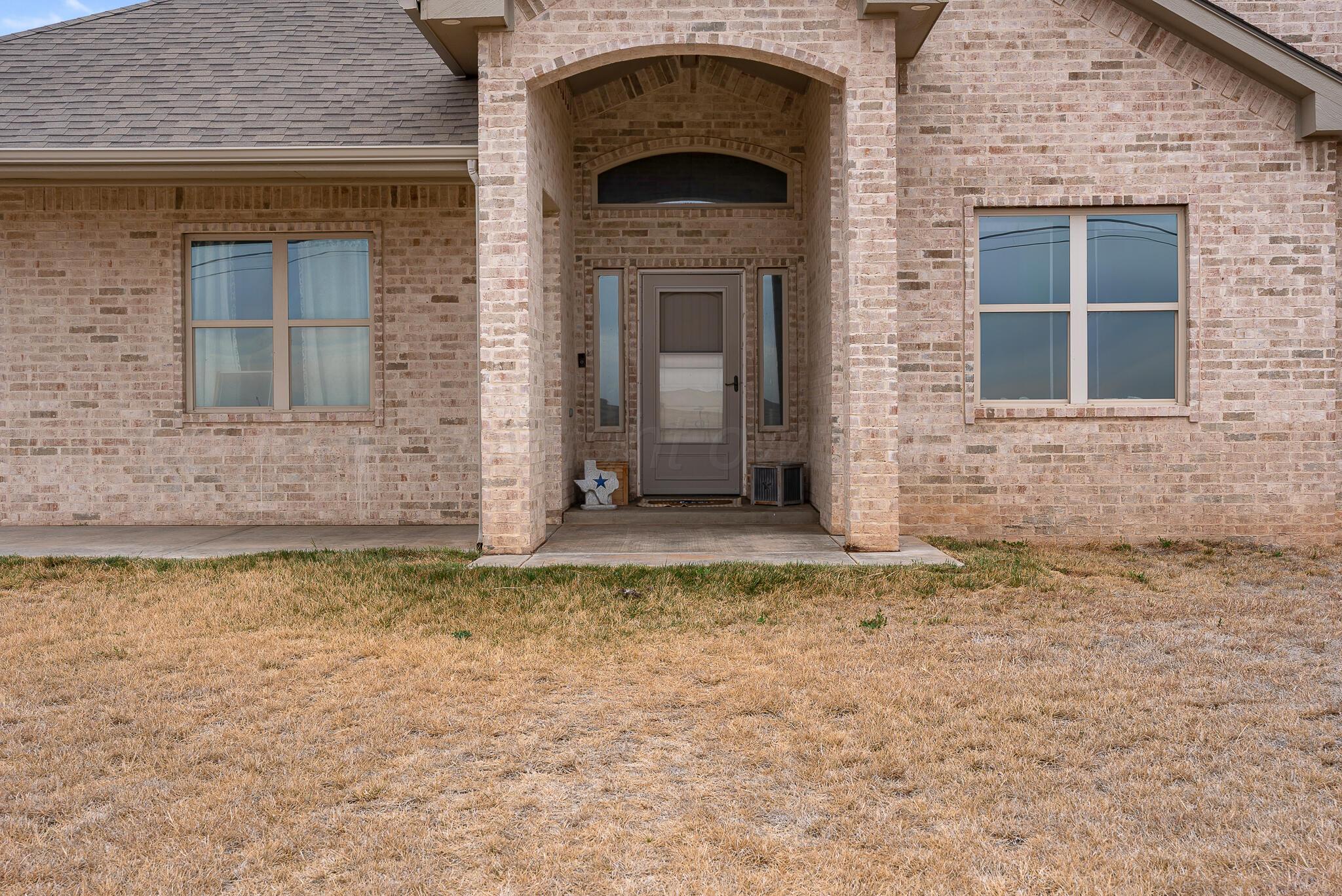 151 North Fm 2381 Amarillo, TX 79124 - Photo 4 of 36 a front view of a house with a yard