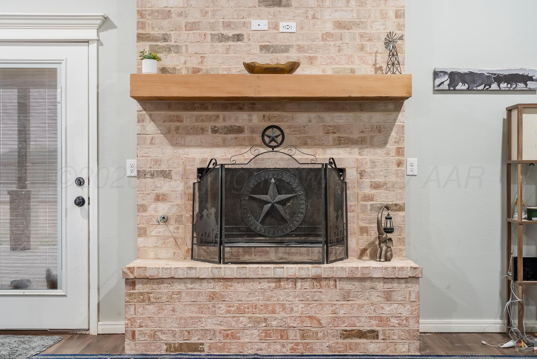 151 North Fm 2381 Amarillo, TX 79124 - Photo 7 of 36 a view of a fireplace with wooden floor