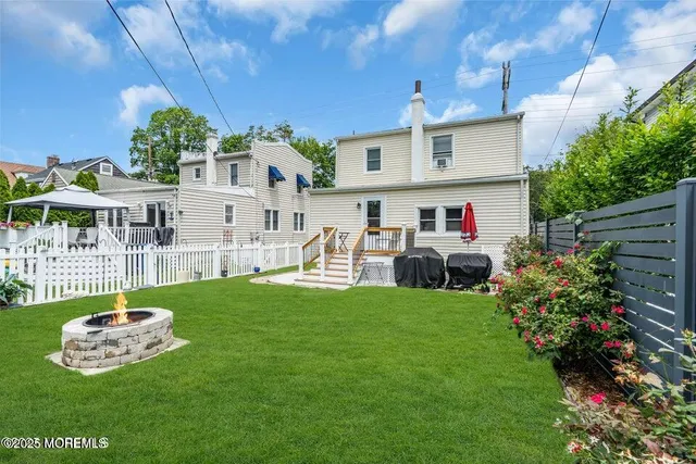 a front view of a house with a garden and plants