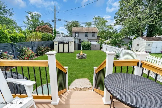 a balcony with an outdoor seating