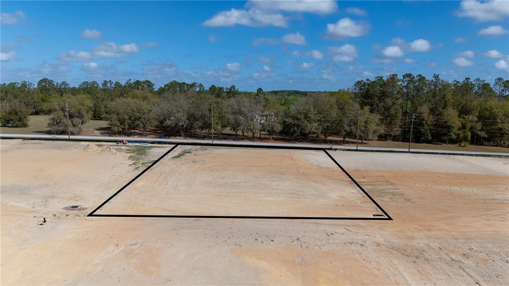 32880 Dunne Road San Antonio, FL 33576 - Photo 2 of 11 a view of a swimming pool with a lake view and mountain view