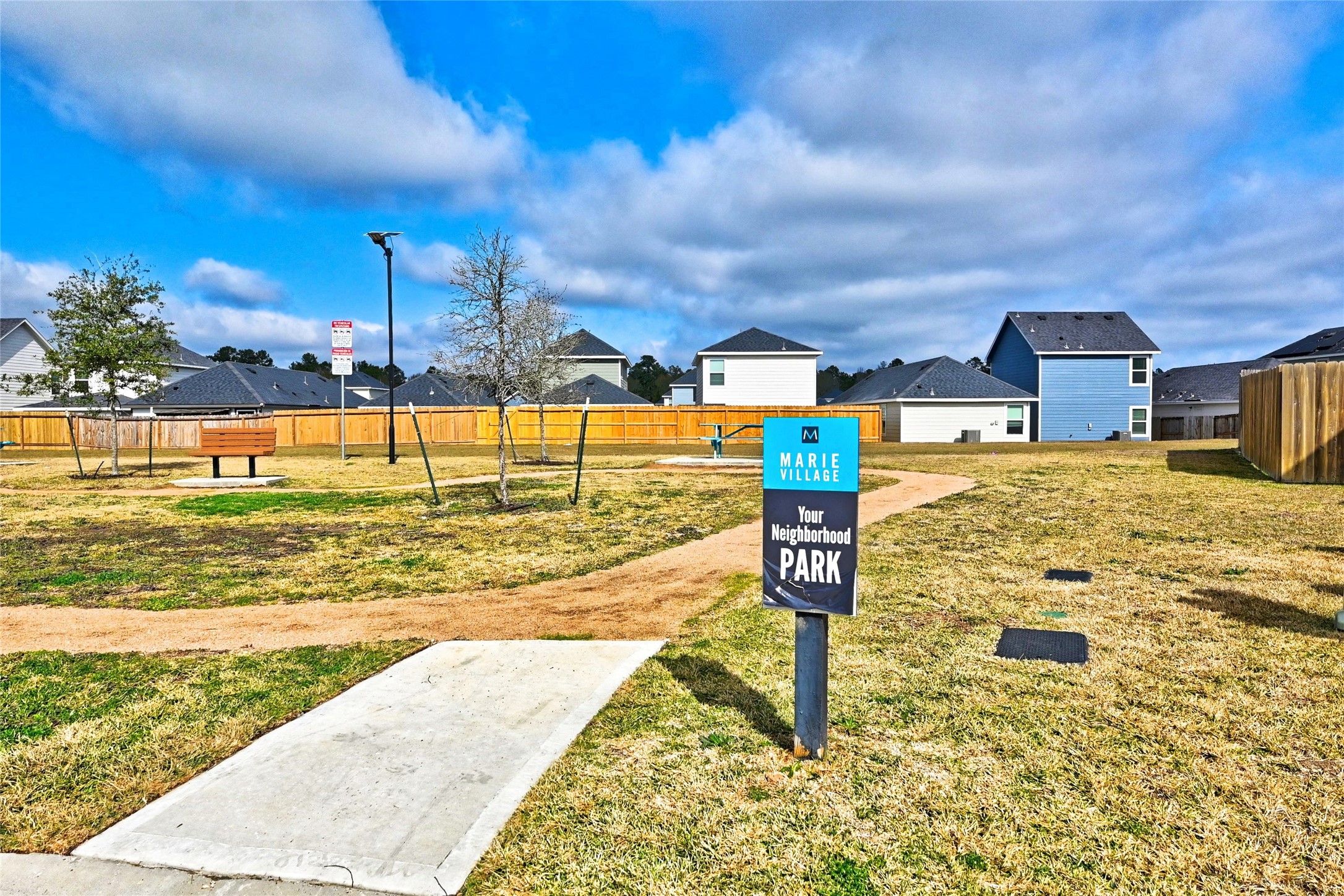 16623 Colleen Place Conroe, TX 77306 - Photo 5 of 44 Community picnic tables and green space next door to the home.
