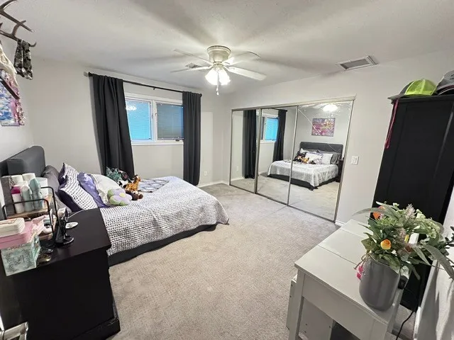 a bathroom with double sink and a mirror