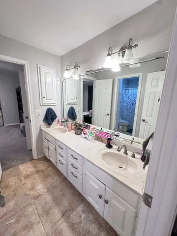 a view of a house with swimming pool and sitting area