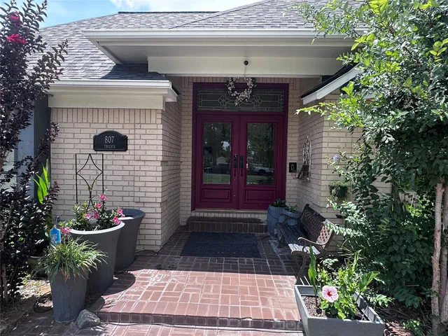 a kitchen with stainless steel appliances a refrigerator sink and cabinets