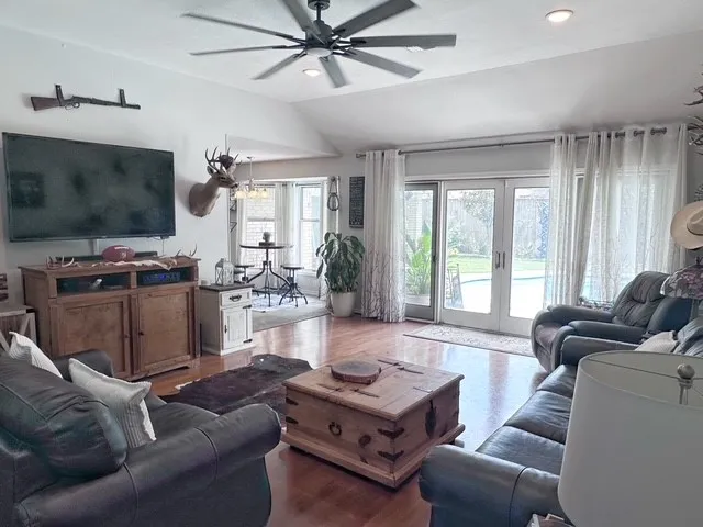 a view of an entryway with wooden floor
