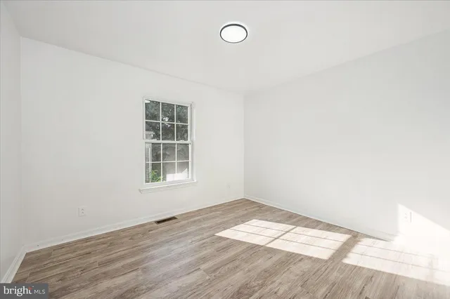 a view of a livingroom with wooden floor