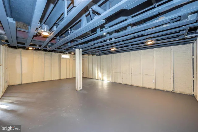 a view of a backyard with plants and a backyard