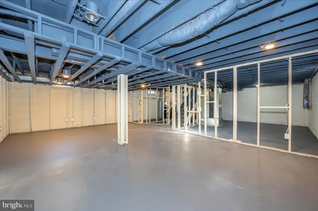 a view of a backyard with potted plants and wooden fence