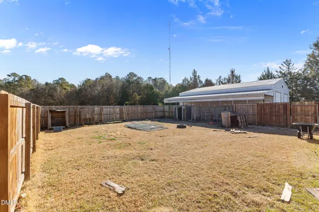 a house view with a backyard space