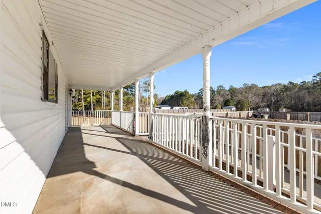 a view of balcony with furniture