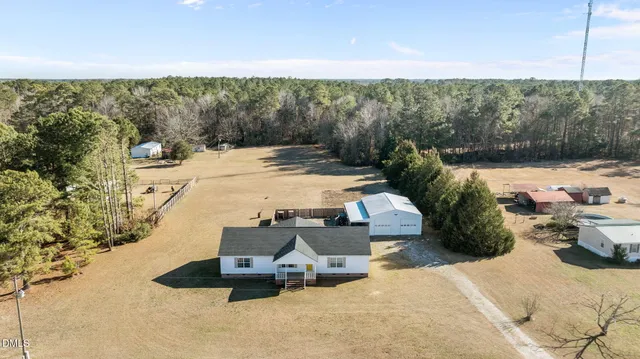 a view of a backyard of the house