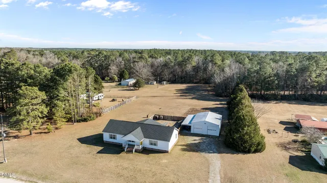 a view of a patio with a table and chairs