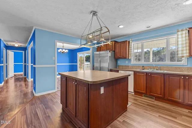 a kitchen with a stove and a sink