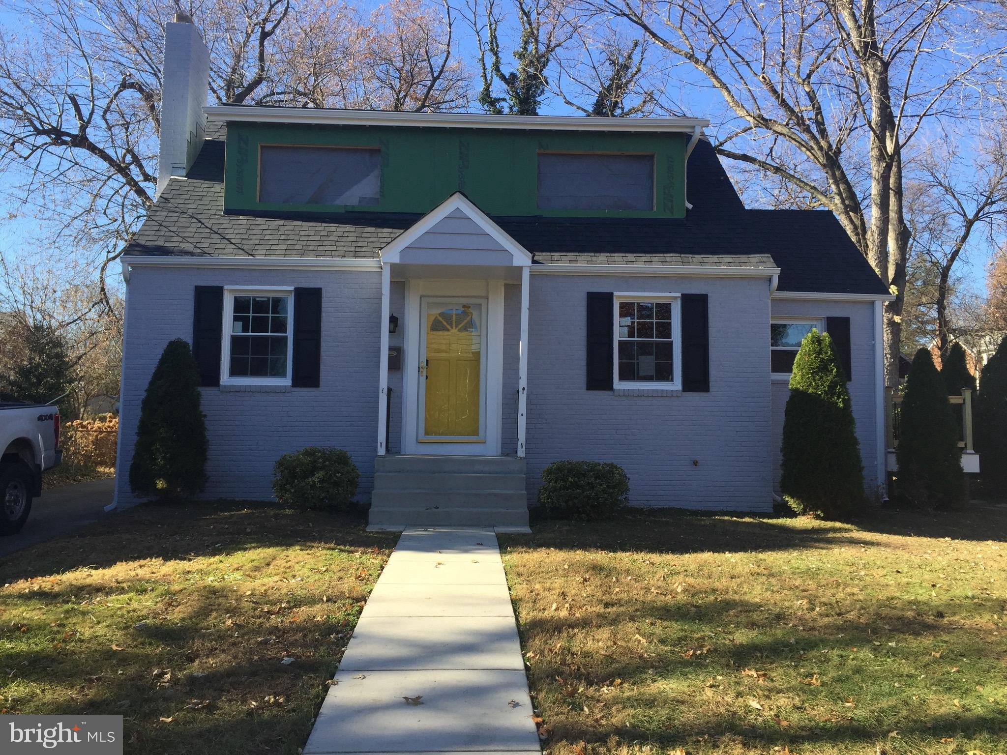 9506 Saybrook Avenue Silver Spring, MD 20901 - Photo 1 of 1 a front view of a house with a yard