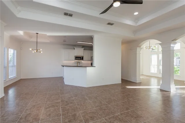 a view of a kitchen with a sink and dishwasher cabinet with wooden floor