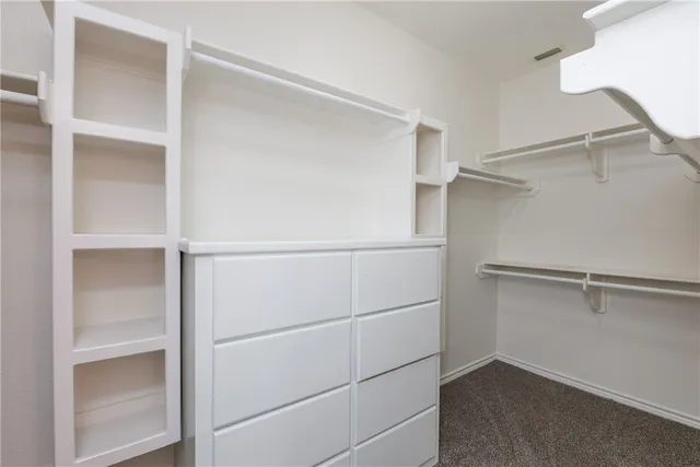 a view of an empty walk in closet