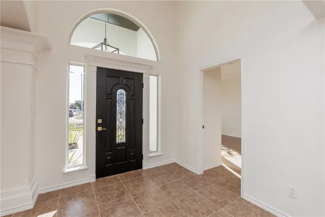 a view of an entryway with a mirror