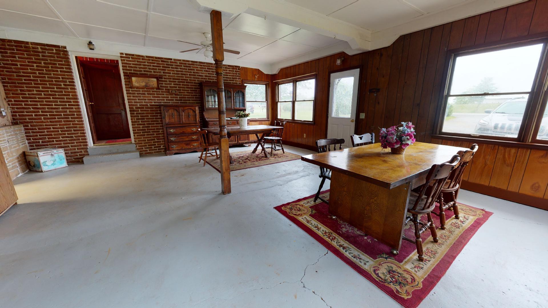 420 Long Level Road Southwest Floyd, VA 24091 - Photo 5 of 15 a living room with furniture a rug and a large window