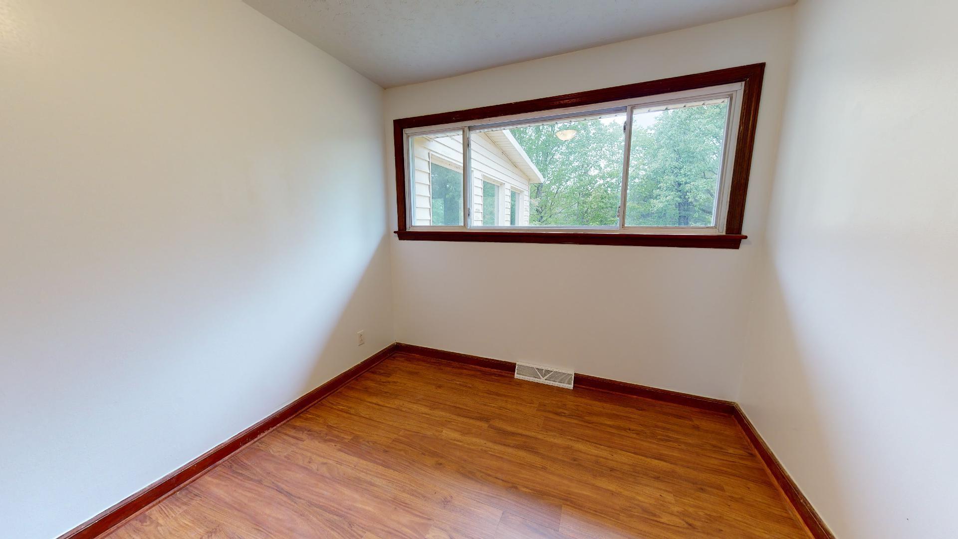 420 Long Level Road Southwest Floyd, VA 24091 - Photo 8 of 15 a view of empty room with wooden floor and fan