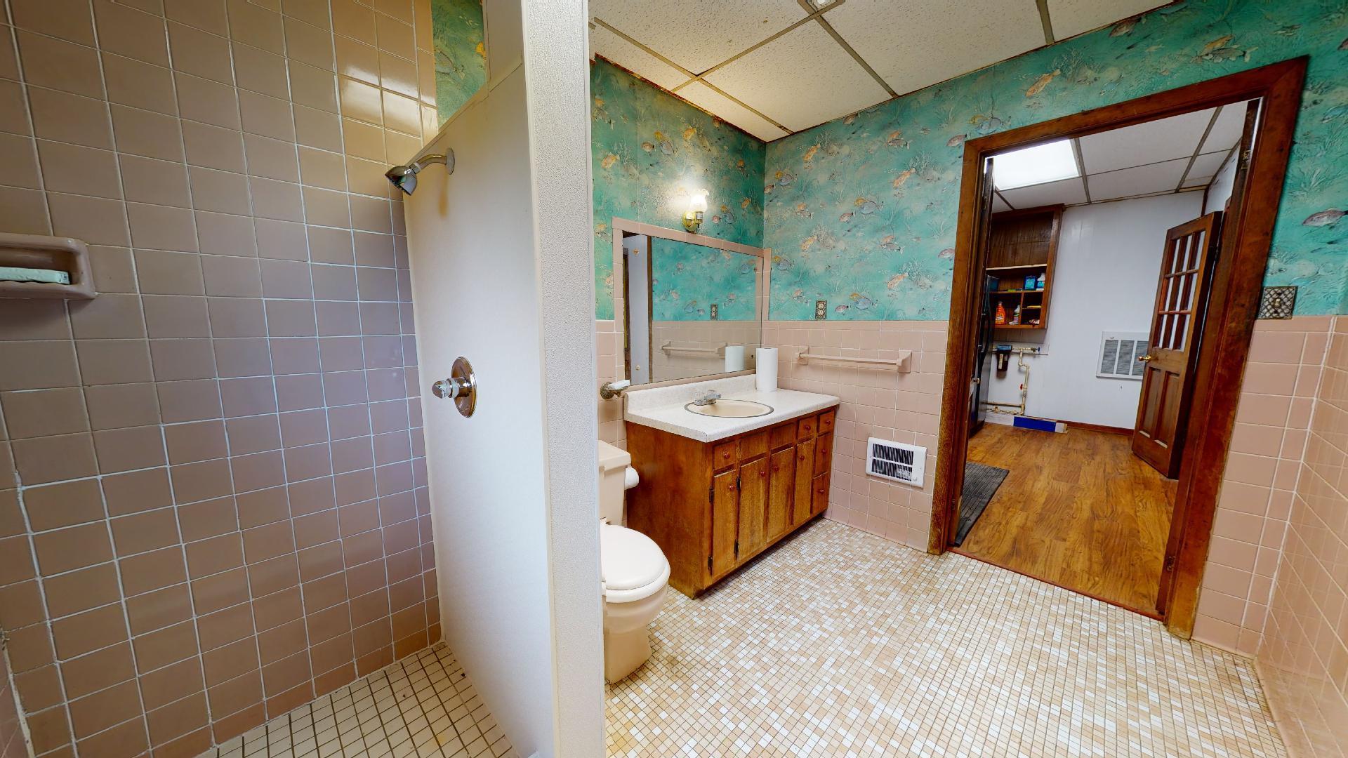 420 Long Level Road Southwest Floyd, VA 24091 - Photo 10 of 15 a bathroom with a tub sink and mirror