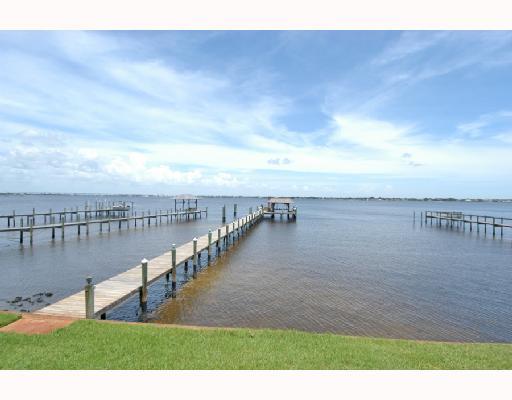 1417 Southeast Riverside Drive Stuart, FL 34996 - Photo 4 of 8 a view of a lake with a garden