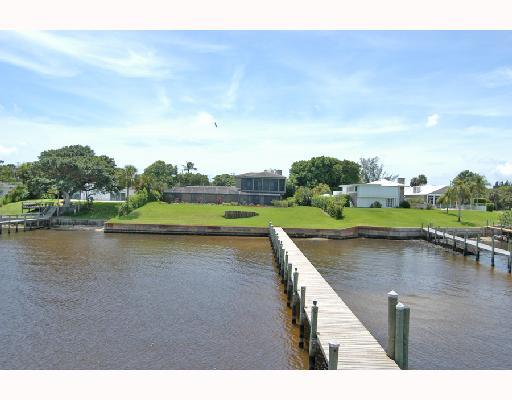 1417 Southeast Riverside Drive Stuart, FL 34996 - Photo 5 of 8 a view of a lake with houses in the back
