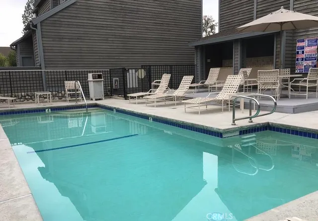 a view of a swimming pool with a patio